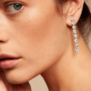 Diamond dangle earrings on model. Rose cut diamonds with brilliant cut diamonds in a micro pave setting. 