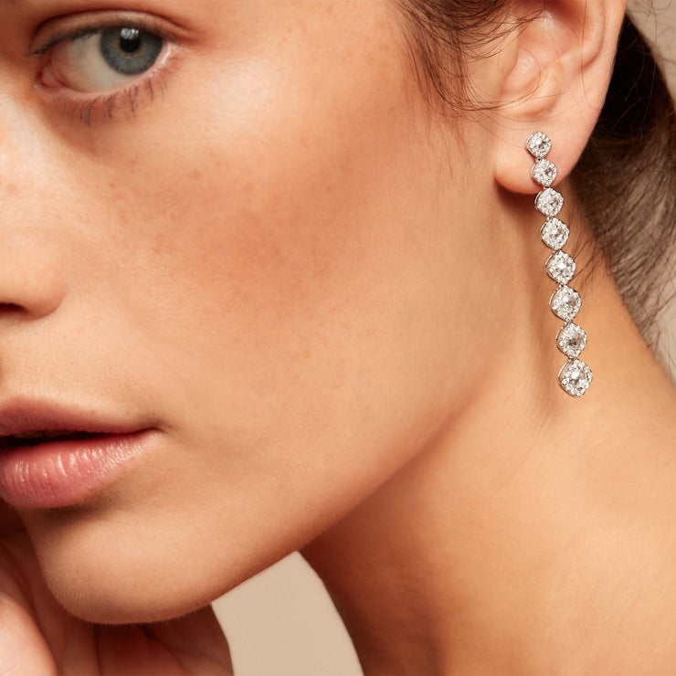 Diamond dangle earrings on model. Rose cut diamonds with brilliant cut diamonds in a micro pave setting. 