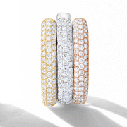 Three gold diamond huggies. Small brilliant cut diamonds in a pave setting in three gold tones: 18k yellow, white and rose gold