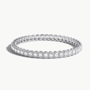 Scallop Diamond Bangle Bracelet. Round rose-cut diamonds accented by round brilliant cut diamonds. 18k White Gold.