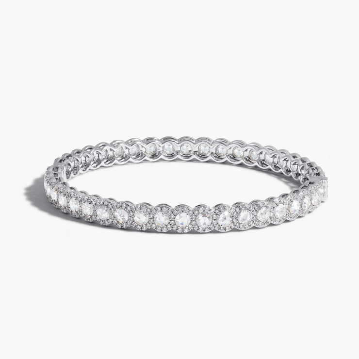 Scallop Diamond Bangle Bracelet. Round rose-cut diamonds accented by round brilliant cut diamonds. 18k White Gold.