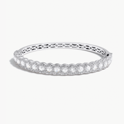 Oval Shaped Hinged Diamond Half-Bangle. Round rose-cut diamonds accented by round brilliant-cut diamonds on front-side, with pave diamonds spread out on the back-side. 18k White Gold. 